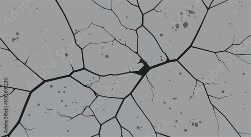 Cracked grayscale surface with splatters and intricate fracture lines spreading