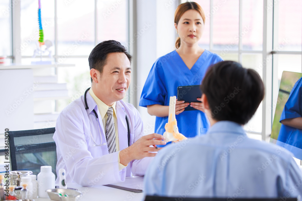 Fototapeta premium Asian male doctor consulting explain medications to senior female patient assisted by caregiver and nurse professional support trust healthcare checkup, insurance treatment wellness in hospital clinic