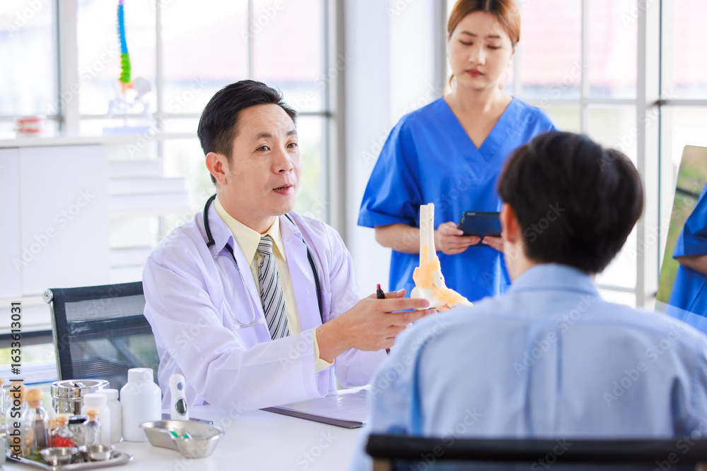 Fototapeta premium Asian male doctor consulting explain medications to senior female patient assisted by caregiver and nurse professional support trust healthcare checkup, insurance treatment wellness in hospital clinic