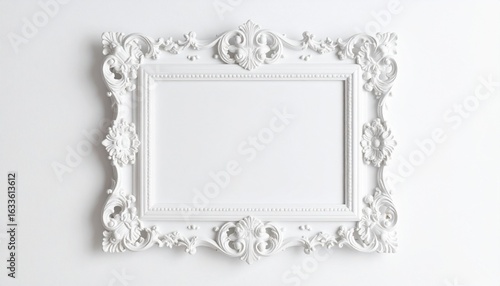 Elegant White Baroque Frame with Intricate Carvings on a Minimalist White Wall.