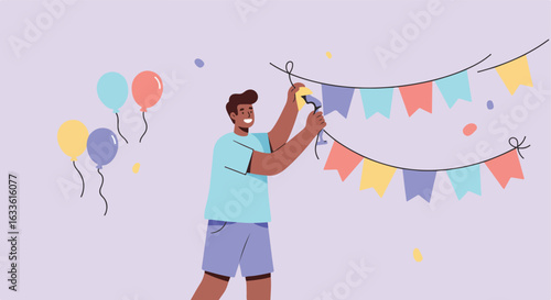 Person hangs up colorful flags with balloons and confetti at a party