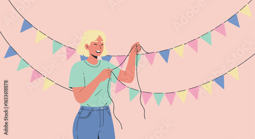 Woman smiling, holding festive garland with pastel flags on pink background