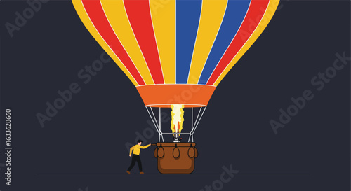 Man pushes hot air balloon
