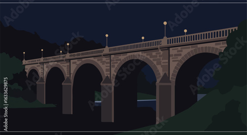 Lit bridge arches at dusk