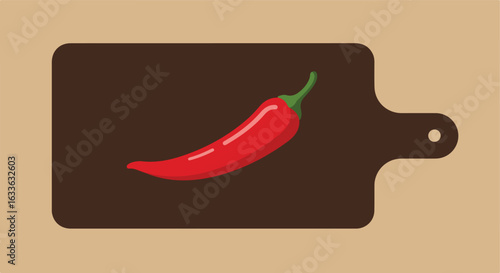 Red chili pepper on a dark brown cutting board, light tan background