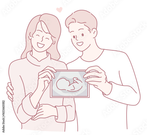 Happy couple cherishing their baby's ultrasound photo, celebrating their upcoming journey into parenthood.