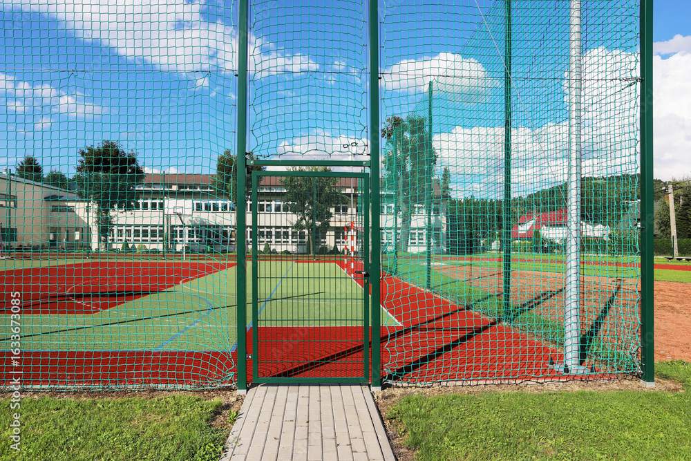 Fototapeta premium A closed playing field. A fenced sports area where play is prohibited due to external restrictions.