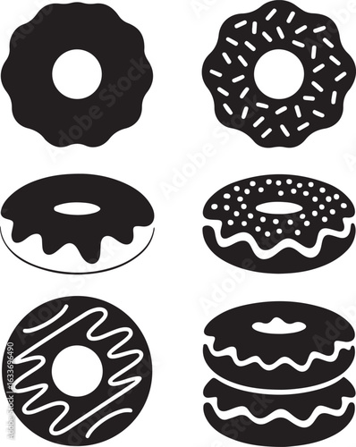 Black donuts with various toppings white frosting