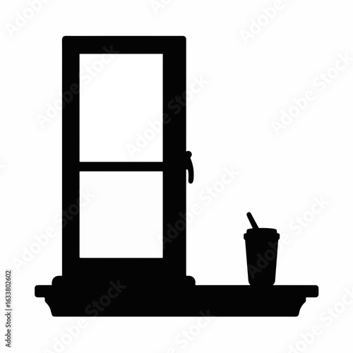 Silhouette of sippy cup on windowsill in black and white, minimalism