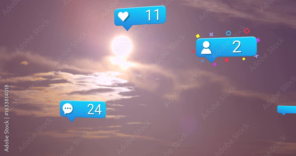 Obraz premium Glowing sun shining behind wispy clouds at sunset with floating heart11, comment24, user2 icons