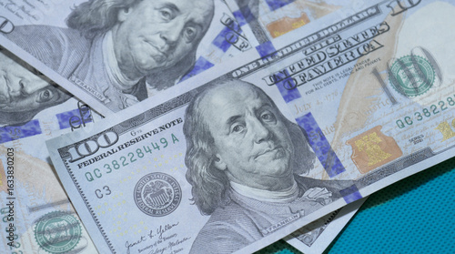 Wallpaper Mural Currency bills featuring Benjamin Franklin in close-up view showcasing detailed design elements and colors Torontodigital.ca