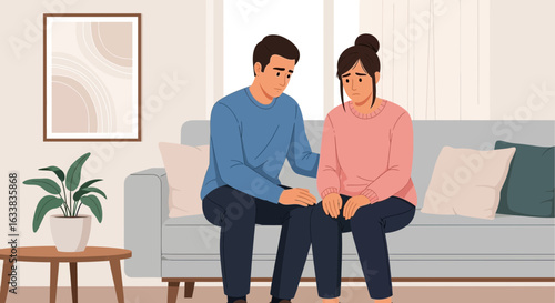 Couple Supporting Each Other Through Difficult Times on Sofa in the Living Room