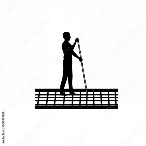Silhouette of an urban planner using a measuring tape on a sidewalk