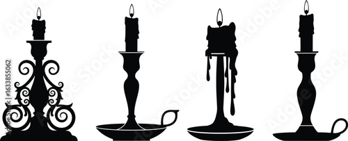 Four ornate antique candle holders with burning candles silhouette