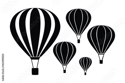 Group of black hot air balloons flying together