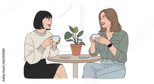 Two Young Women Enjoying Coffee And Conversation At A Cafe Meeting
