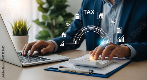 Businessman calculating taxes with a calculator and laptop, surrounded by financial icons