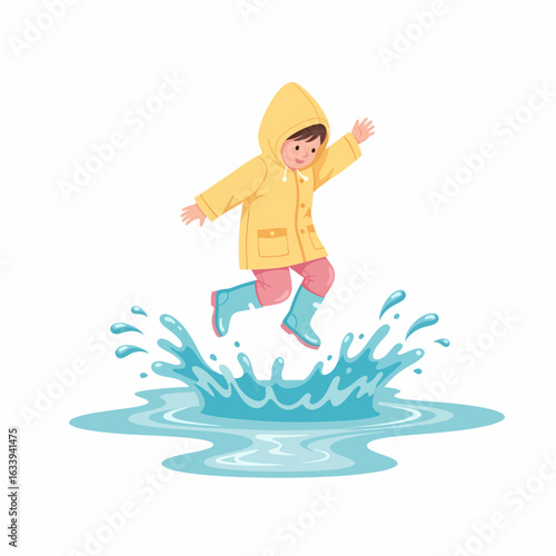 Cheerful child in a yellow raincoat and blue boots jumping happily into a water puddle.