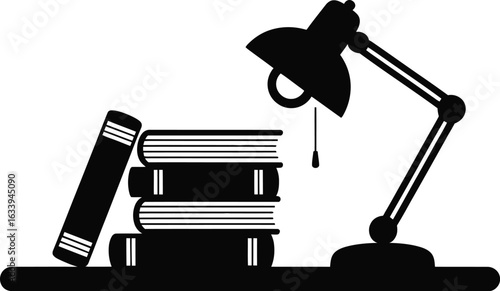 Stack of books and desk lamp silhouette reading studying