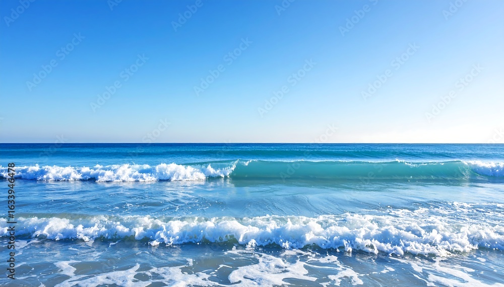 Fototapeta premium Calm ocean waves lapping a sandy shore under a vibrant blue sky