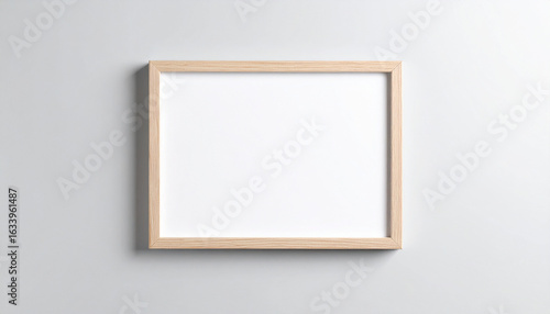 Blank Canvas in a Frame: A sleek, empty wooden frame, ready to be filled, hangs against a simple background, representing potential and creative space.