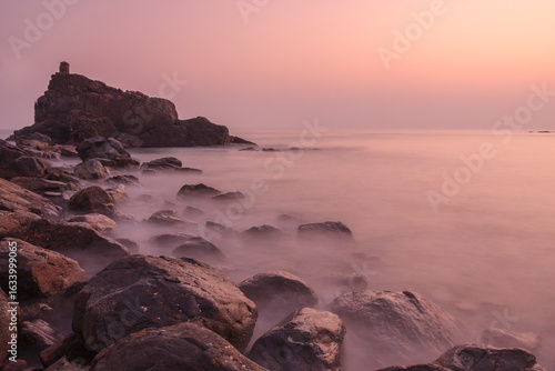 Obraz na plátně Rocky beach of Gokarna - photographed during sunset with slow shutter to render