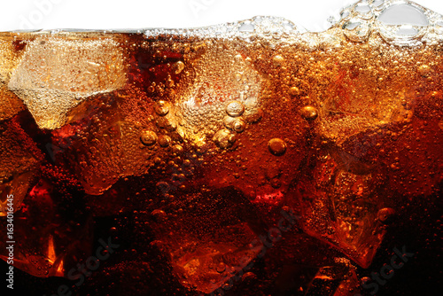 Refreshing cola with ice isolated on white