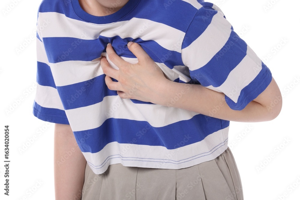 Obraz premium Young woman suffering from chest pain on white background, closeup