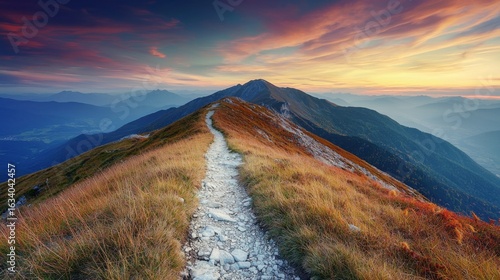 Fototapeta Naklejka Na Ścianę i Meble -  Mountain trail leading along the mountain ridge of beautiful mountains with autumn grass and colorful sky. 