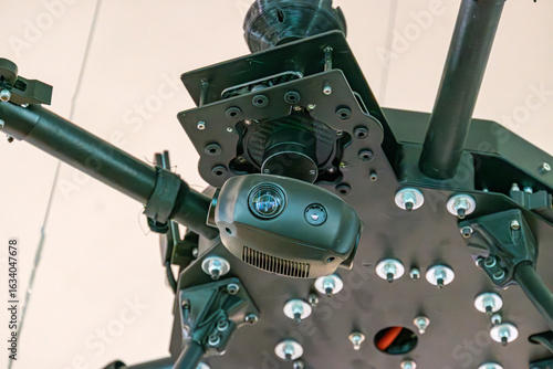 Photography Top-down view of a mechanical Ukrainian military drone component Mainly dark, me