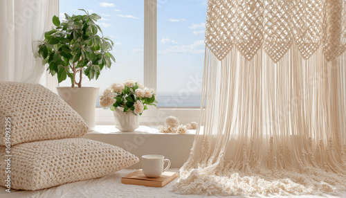 Cozy interior with decorative pillows, potted plant, and cup of tea beside window, creating serene atmosphere