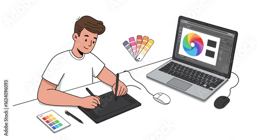 Young graphic designer intently working on his digital art at his desk.