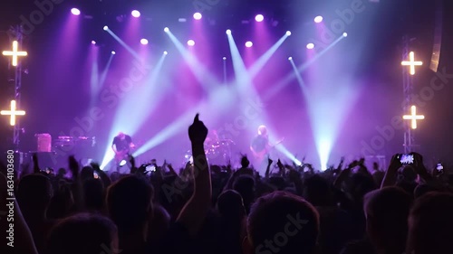 Wallpaper Mural Energetic Live Concert Band Performance on Stage Under Vibrant Purple Spotlights with Cheering Crowd and Hazy Beams - Music Event Atmosphere Torontodigital.ca