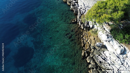 Dugi Otok's rugged stone coast stuns with raw Adriatic beauty—dramatic cliffs, crystal-clear waters, and golden light perfect for breathtaking, timeless photography.