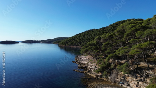 Dugi Otok's rugged stone coast stuns with raw Adriatic beauty—dramatic cliffs, crystal-clear waters, and golden light perfect for breathtaking, timeless photography.