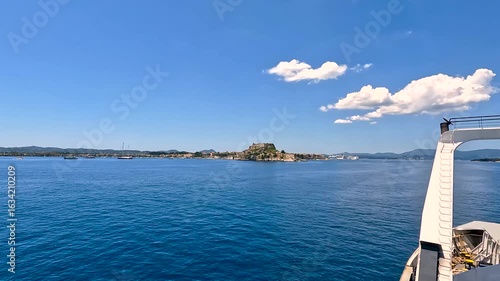 Wallpaper Mural Breathtaking panoramic view of historic Corfu town coastline from the sparkling Ionian Sea showcasing traditional Greek island architecture and azure waters.
 Torontodigital.ca