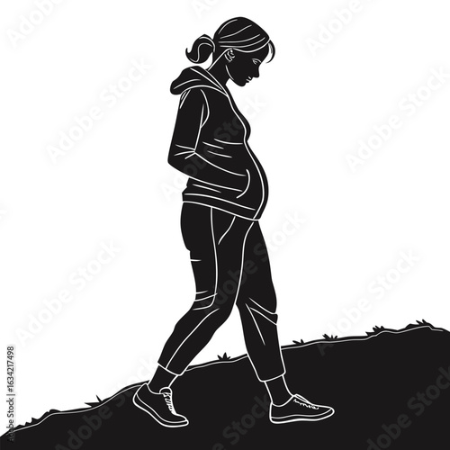 Silhouette of beautiful pregnant woman walking