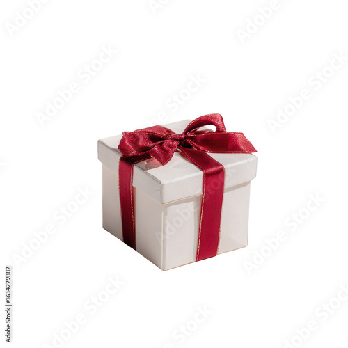 A beautifully wrapped white gift box with a red satin ribbon, perfect for any occasion, isolated on a white background.