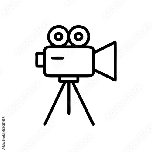 Classic movie camera on tripod captures cinematic moments in black and white minimalism at a creative studio