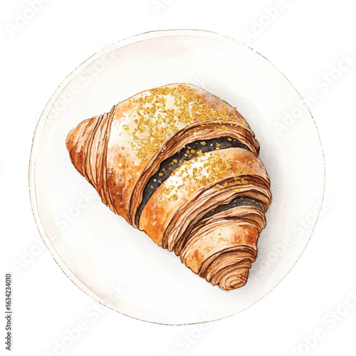 a cute Charcoal croissant with gold dust topping on it