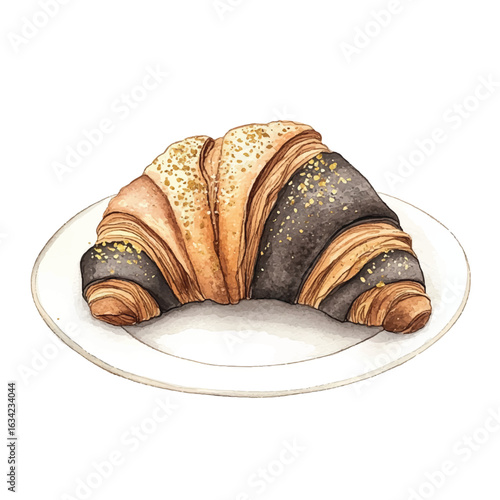 a cute Charcoal croissant with gold dust topping on it