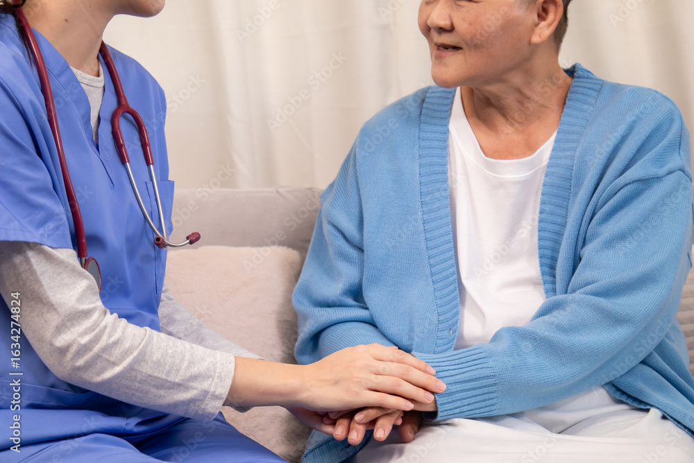 Obraz premium Caregiver in clinic consultation support, compassionate Nurse handhold senior patient at home shows trust communication, aging wellness journey, gentle touch reassures emotion, anxiety recovery