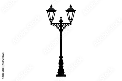 A black silhouette of a vintage street lamp with two lanterns and decorative elements stands tall