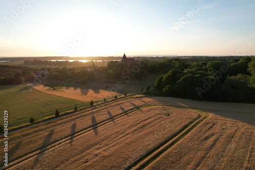 Church of Bobbin at Sunset with Wheat Field