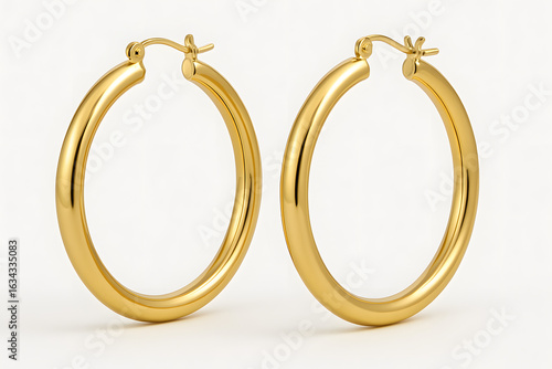Golden Hoop Earrings: Two lustrous, perfectly formed hoop earrings, crafted from radiant gold, sit in exquisite detail, capturing the light and reflecting elegance. 