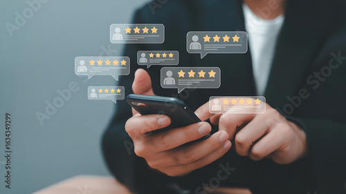 Person using smartphone with glowing star rating review bubbles floating above hand typing