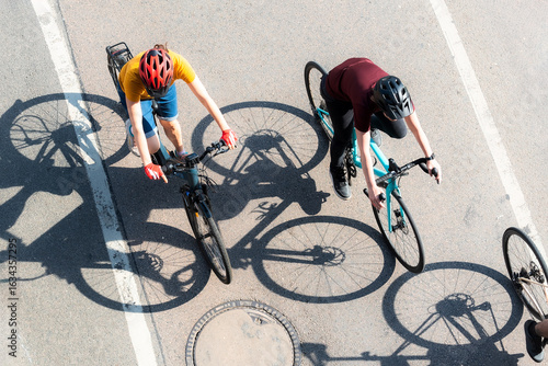 People cycling in the city, top view