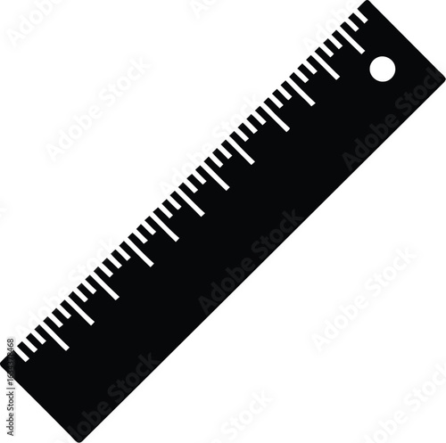 Black metal ruler with clear markings and a hole for hanging on a white background