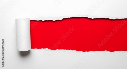 A white paper is torn horizontally revealing a vibrant red background