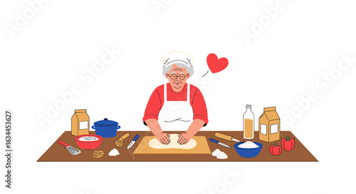 An elderly woman with love kneading dough with her hands on a wooden table preparing a delicious homemade meal for her family